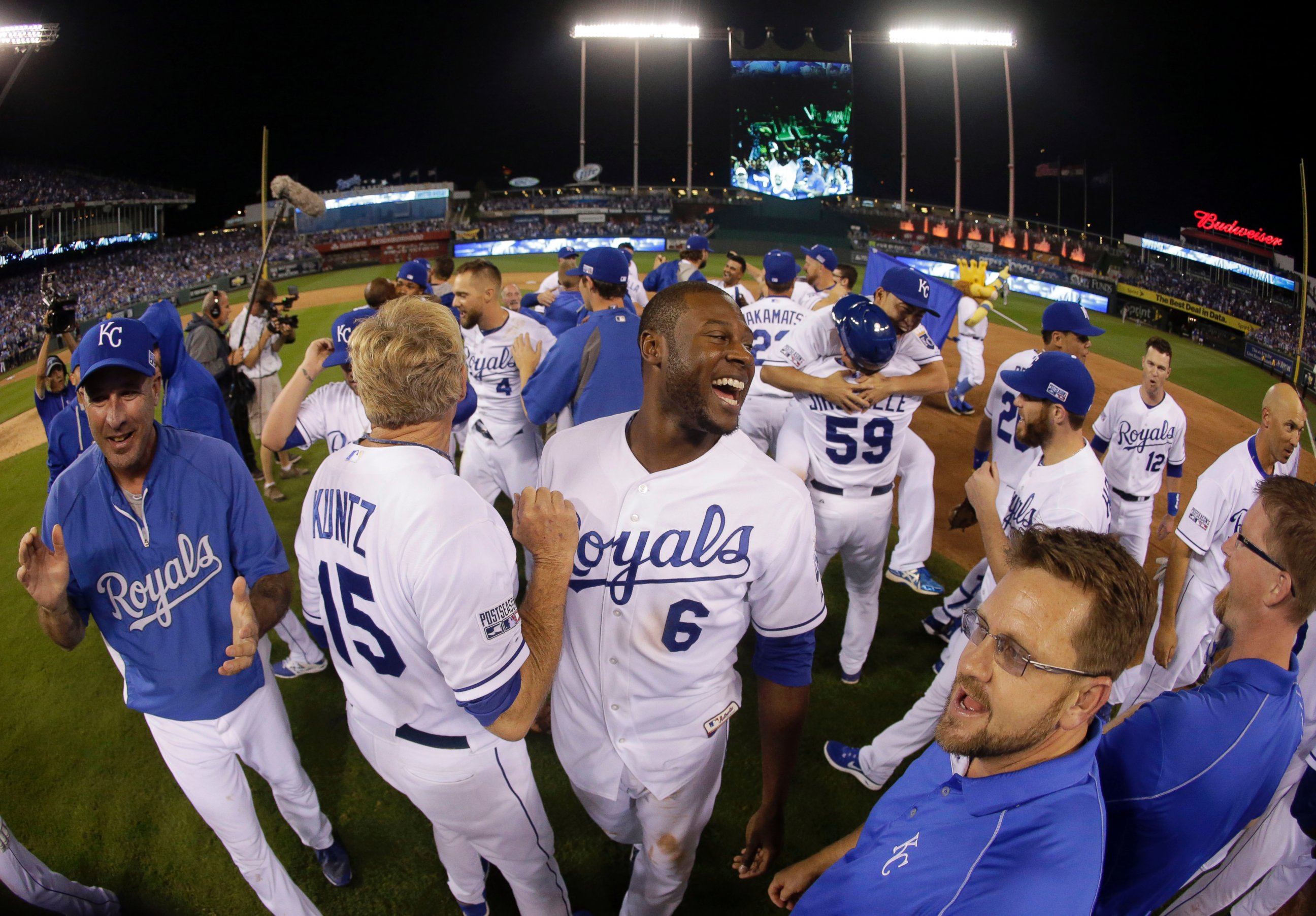 PHOTO: Kansas City Royals' Lorenzo Cain (6) smiles with his teammates after the Royals defeated the Oakland Athletics in the AL wild-card playoff baseball game, Sept. 30, 2014, in Kansas City, Mo.