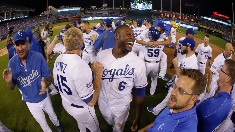 Kansas City Royals' Lorenzo Cain (6) smiles with his teammates after the Royals defeated the Oakland Athletics in the AL wild-card playoff baseball game, Sept. 30, 2014, in Kansas City, Mo.