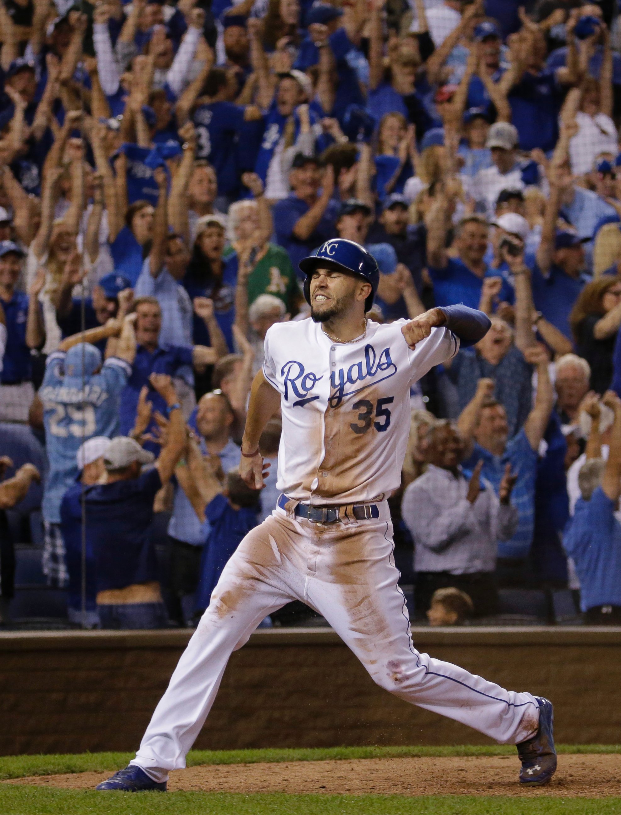 PHOTO: Kansas City Royals' Eric Hosmer celebrates after scoring on a single by Christian Colon during the 12th inning of the AL wild-card playoff baseball game against the Oakland Athletics, Sept. 30, 2014, in Kansas City, Mo.