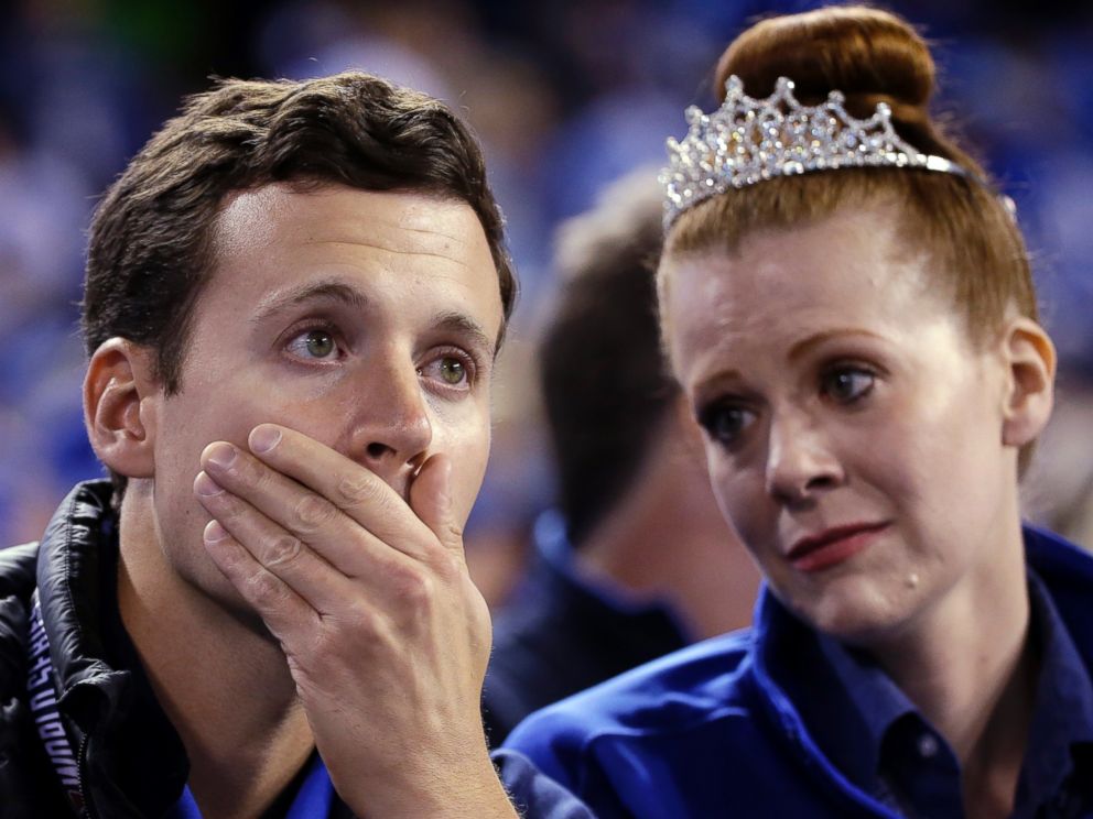 Kansas City Royals fans Heather and James Boland react during the eighth inning of Game 1 of baseball's World Series against the San Francisco Giants, Oct. 21, 2014, in Kansas City, Mo.