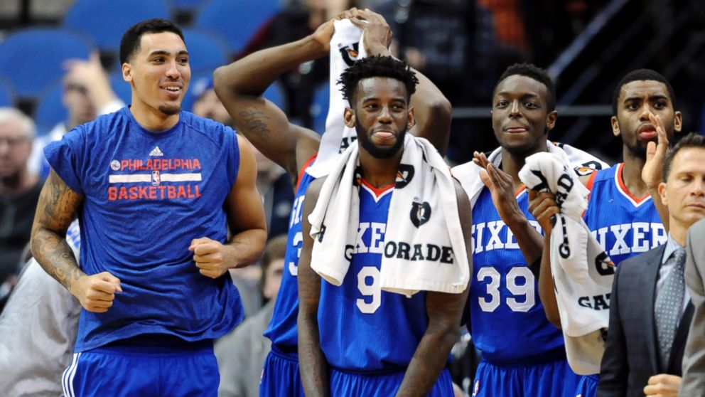 Philadelphia 76ers center Drew Gordon, left, forward JaKarr Sampson (9), forward Jerami Grant (39) and guard Hollis Thompson watch from the bench in the fourth quarter of an NBA basketball game against the Minnesota Timberwolves, Dec. 3, 2014, in Minneapolis.