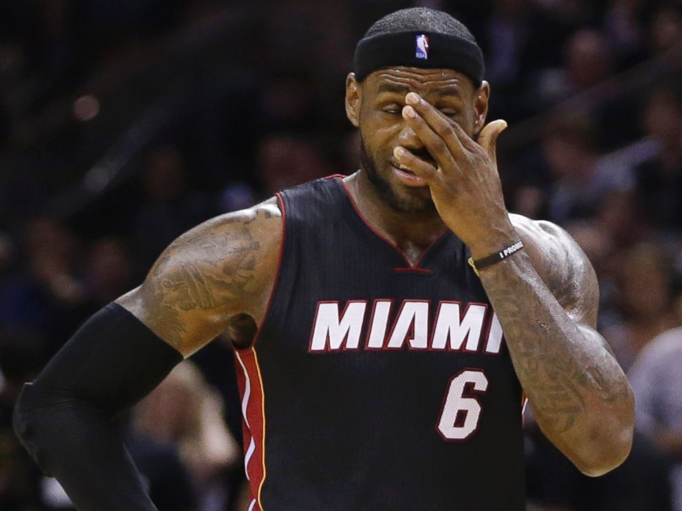 PHOTO: Miami Heat forward LeBron James pauses between plays against the San Antonio Spurs during the second half in Game 5 of the NBA basketball finals, June 15, 2014, in San Antonio.