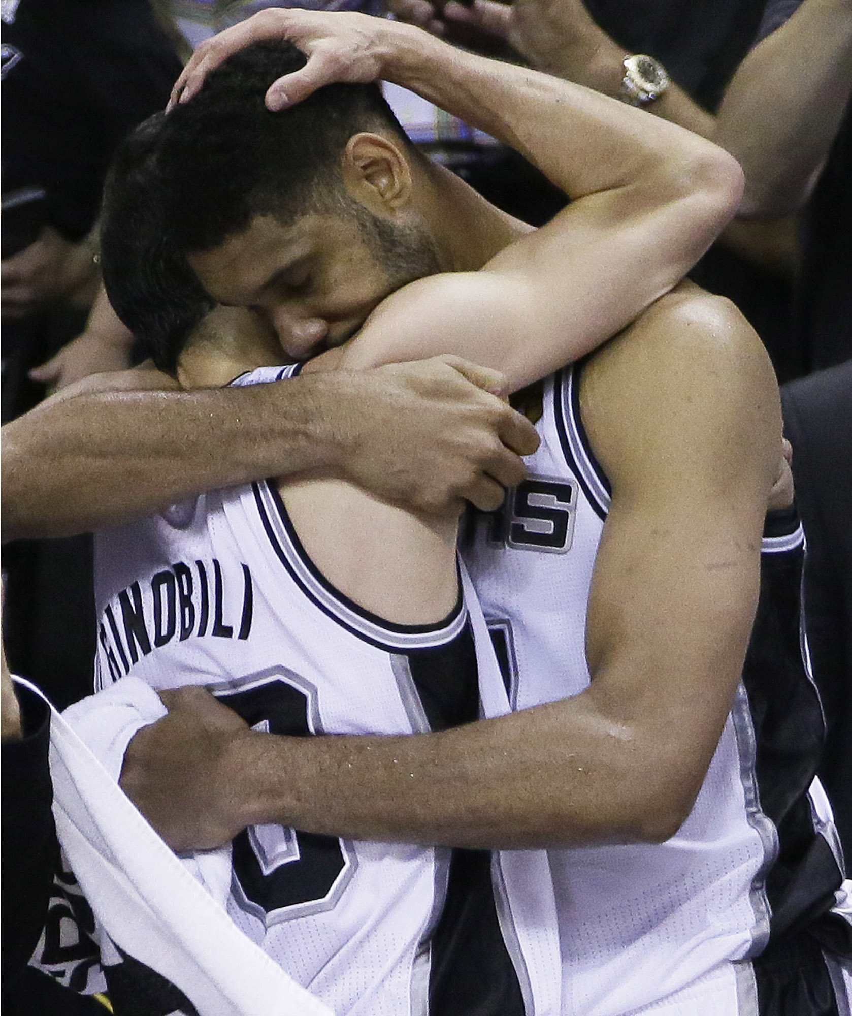 PHOTO: San Antonio Spurs guard Manu Ginobili, left, and forward Tim Duncan embrace in the final moments of Game 5 of the NBA basketball finals against the Miami Heat, June 15, 2014, in San Antonio.