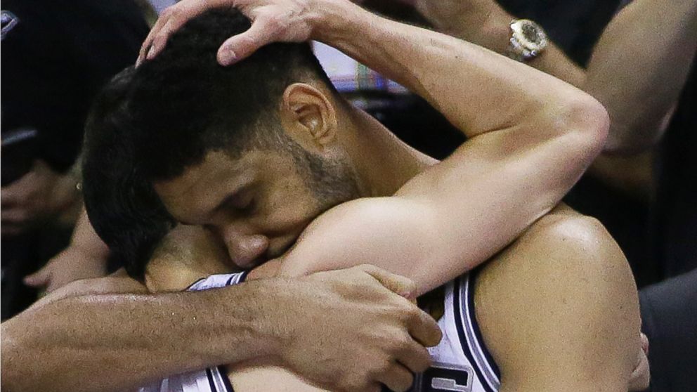 PHOTO: San Antonio Spurs guard Manu Ginobili, left, and forward Tim Duncan embrace in the final moments of Game 5 of the NBA basketball finals against the Miami Heat, June 15, 2014, in San Antonio.
