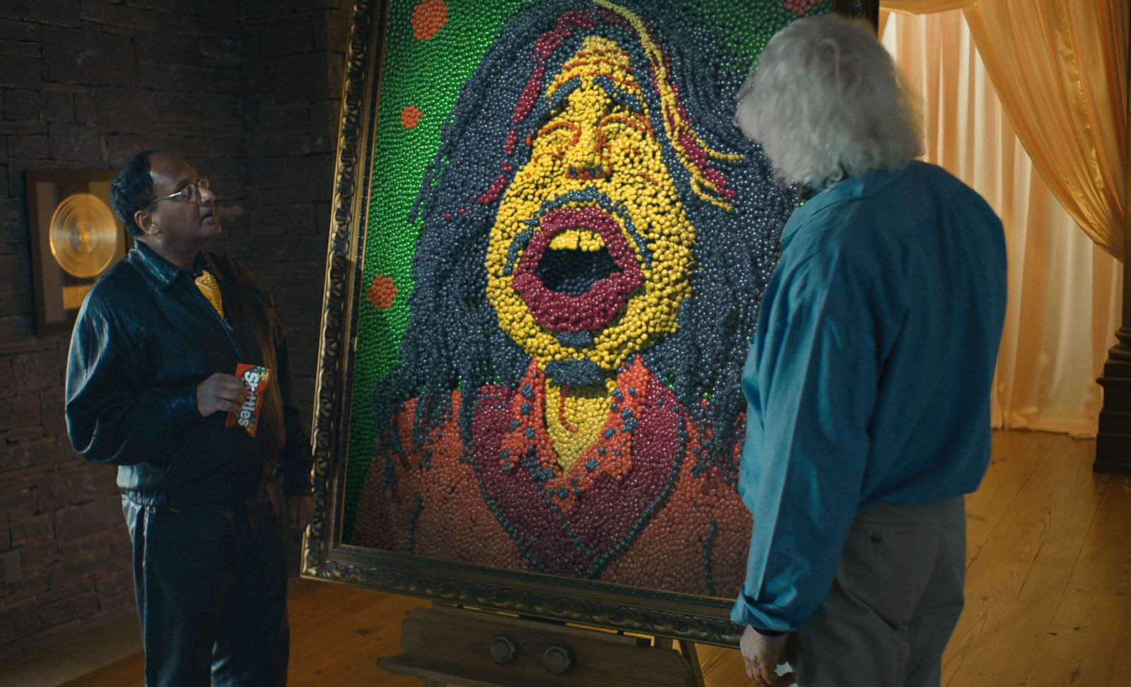 Co. shows a Skittles portrait of Aerosmith front man Steven Tyler being unv...