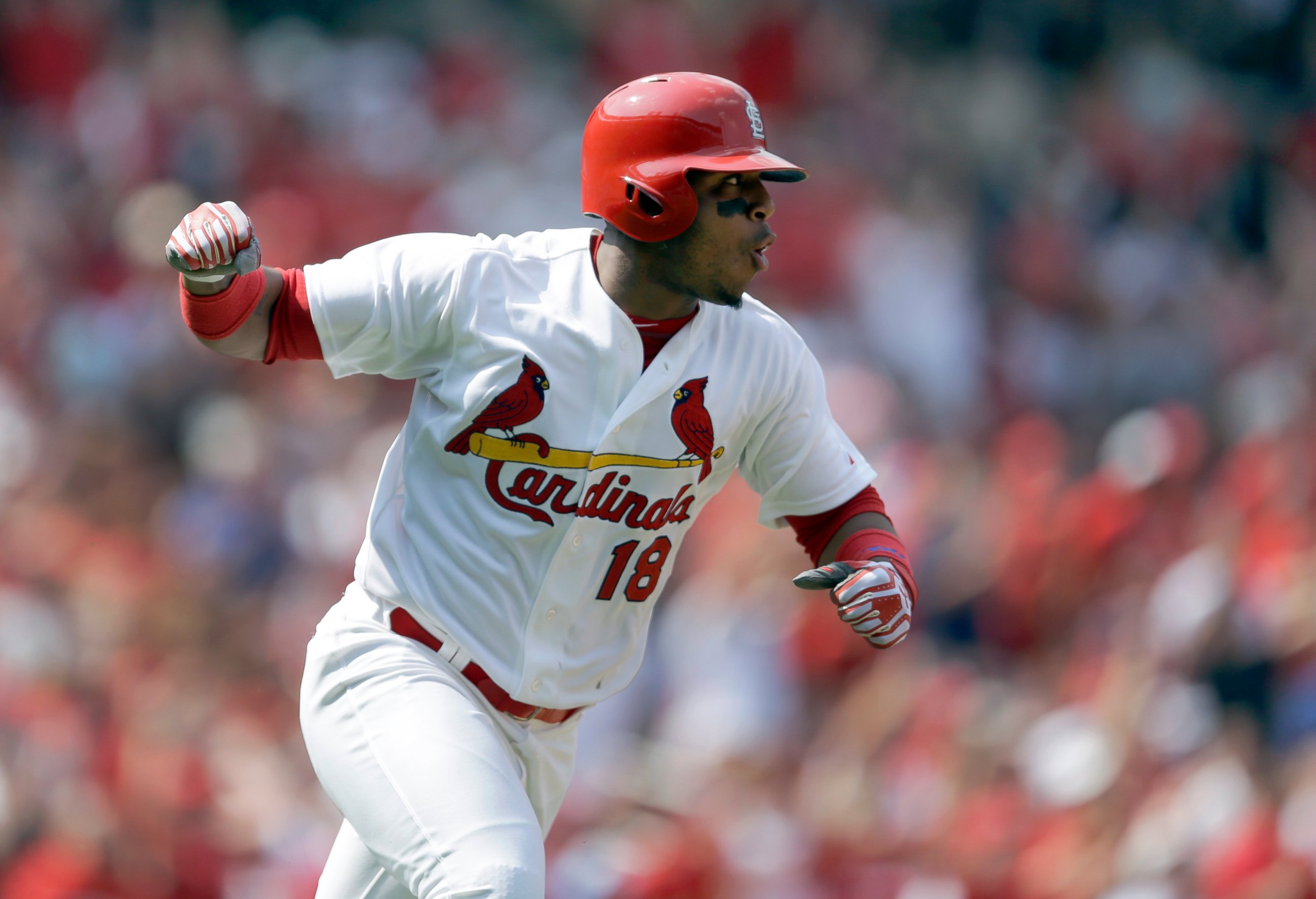 This Aug. 3, 2014 file photo shows St. Louis Cardinals' Oscar Taveras pumping his fist as he runs down the first base line after hitting an RBI single during the seventh inning of a baseball game against the Milwaukee Brewers in St. Louis.