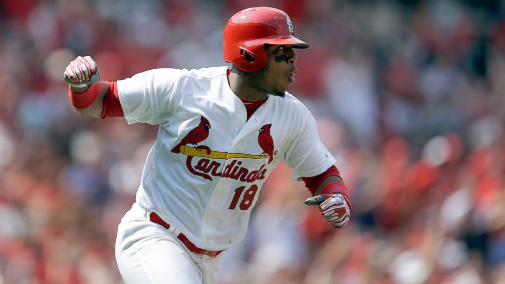 This Aug. 3, 2014 file photo shows St. Louis Cardinals' Oscar Taveras pumping his fist as he runs down the first base line after hitting an RBI single during the seventh inning of a baseball game against the Milwaukee Brewers in St. Louis.