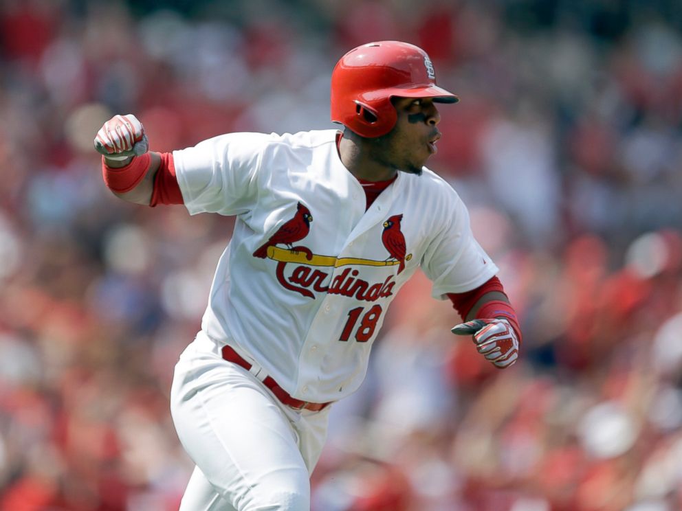 This Aug. 3, 2014 file photo shows St. Louis Cardinals Oscar Taveras pumping his fist as he runs down the first base line after hitting an RBI single during the seventh inning of a baseball game against the Milwaukee Brewers in St. Louis.