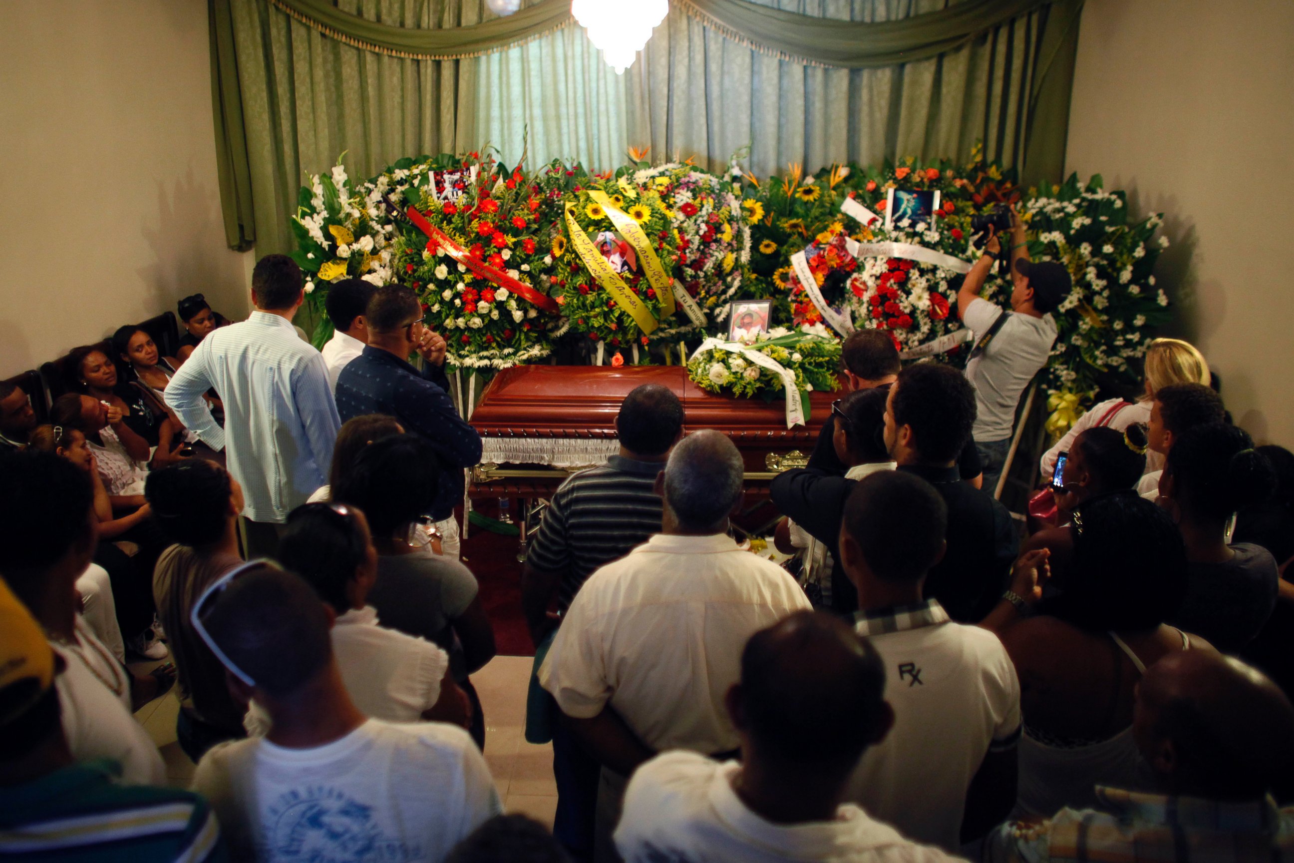 Mourners pay their last respects to St. Louis Cardinals outfielder Oscar Taveras during his wake in Sosua, Dominican Republic, Oct. 28, 2014.