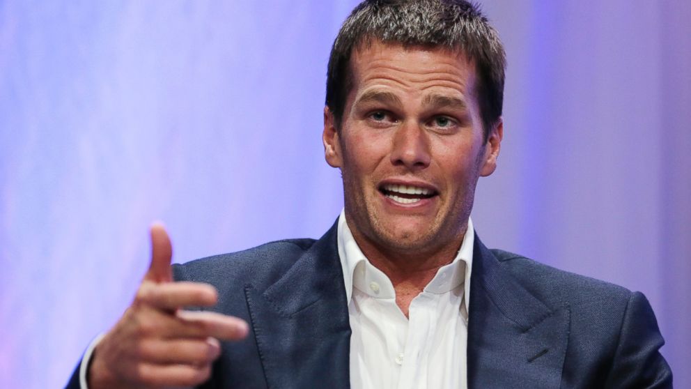 New England Patriots quarterback Tom Brady gestures during an event at Salem State University in Salem, Mass., Thursday, May 7, 2015. An NFL investigation has found that New England Patriots employees likely deflated footballs and that quarterback Tom Brady was "at least generally aware" of the rules violations. The 243-page report released Wednesday, May 6, 2015, said league investigators found no evidence that coach Bill Belichick and team management knew of the practice.