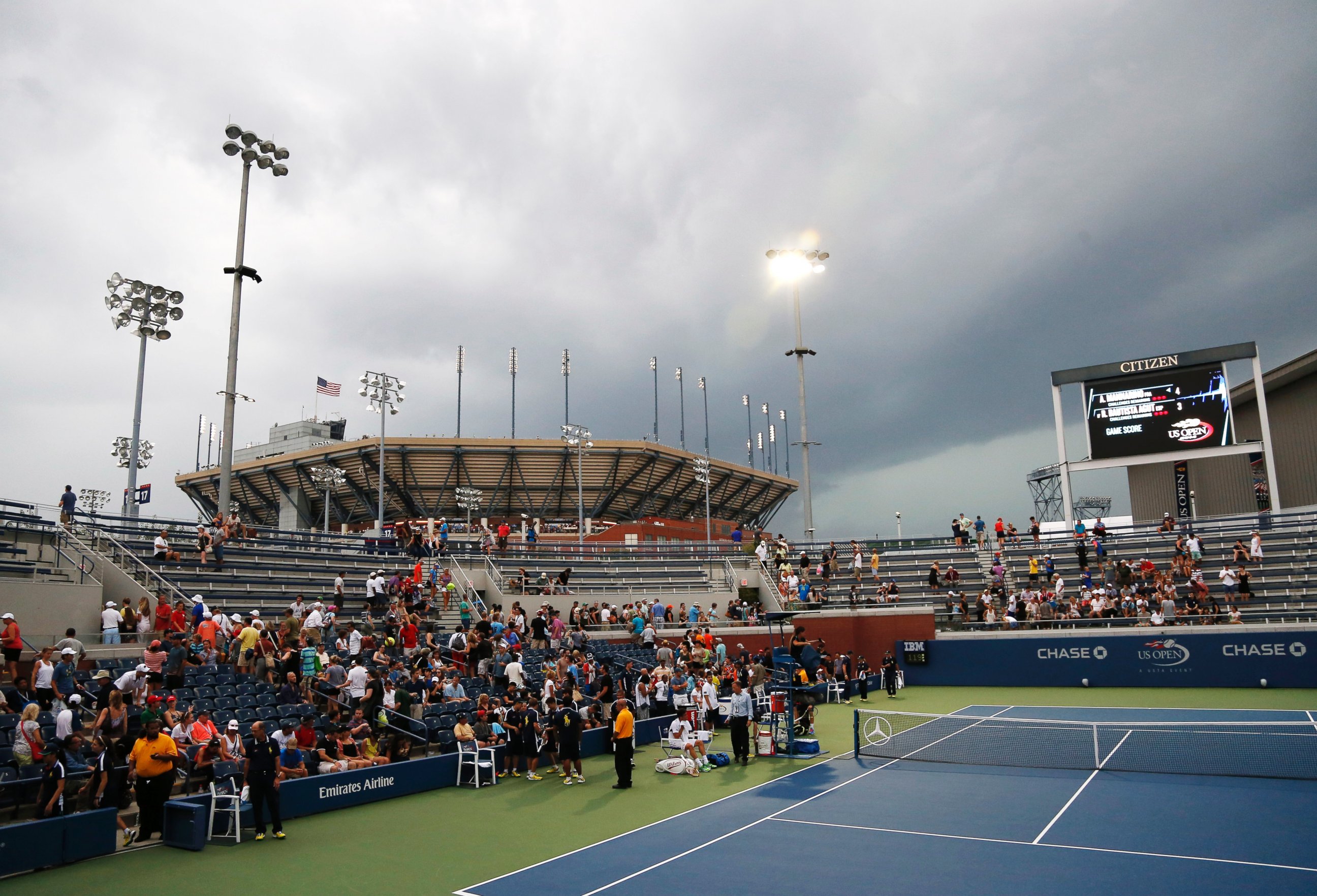 Play is suspended as storm clouds roll over the Billie Jean King National Tennis Center because of imminent lighting during the 2014 U.S. Open tennis tournament, Sunday, Aug. 31, 2014, in New York.