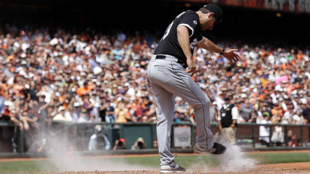 Chicago White Sox manager Robin Ventura kicks dirt over the plate after being ejected during a baseball game against the San Francisco Giants in San Francisco, Aug. 13, 2014.