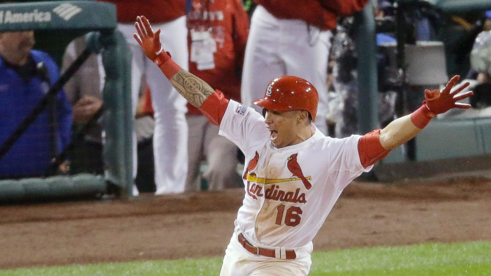 St. Louis Cardinals' Kolten Wong celebrates after hitting a walk off home run during the ninth inning in Game 2 of the National League baseball championship series against the San Francisco Giants, Oct. 12, 2014, in St. Louis.