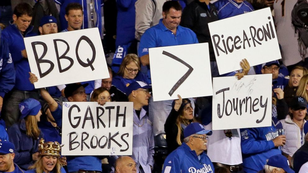 Kansas City Royals fans hold up signs during the sixth inning of Game 6 of baseball's World Series against the San Francisco Giants, Oct. 28, 2014, in Kansas City, Mo.