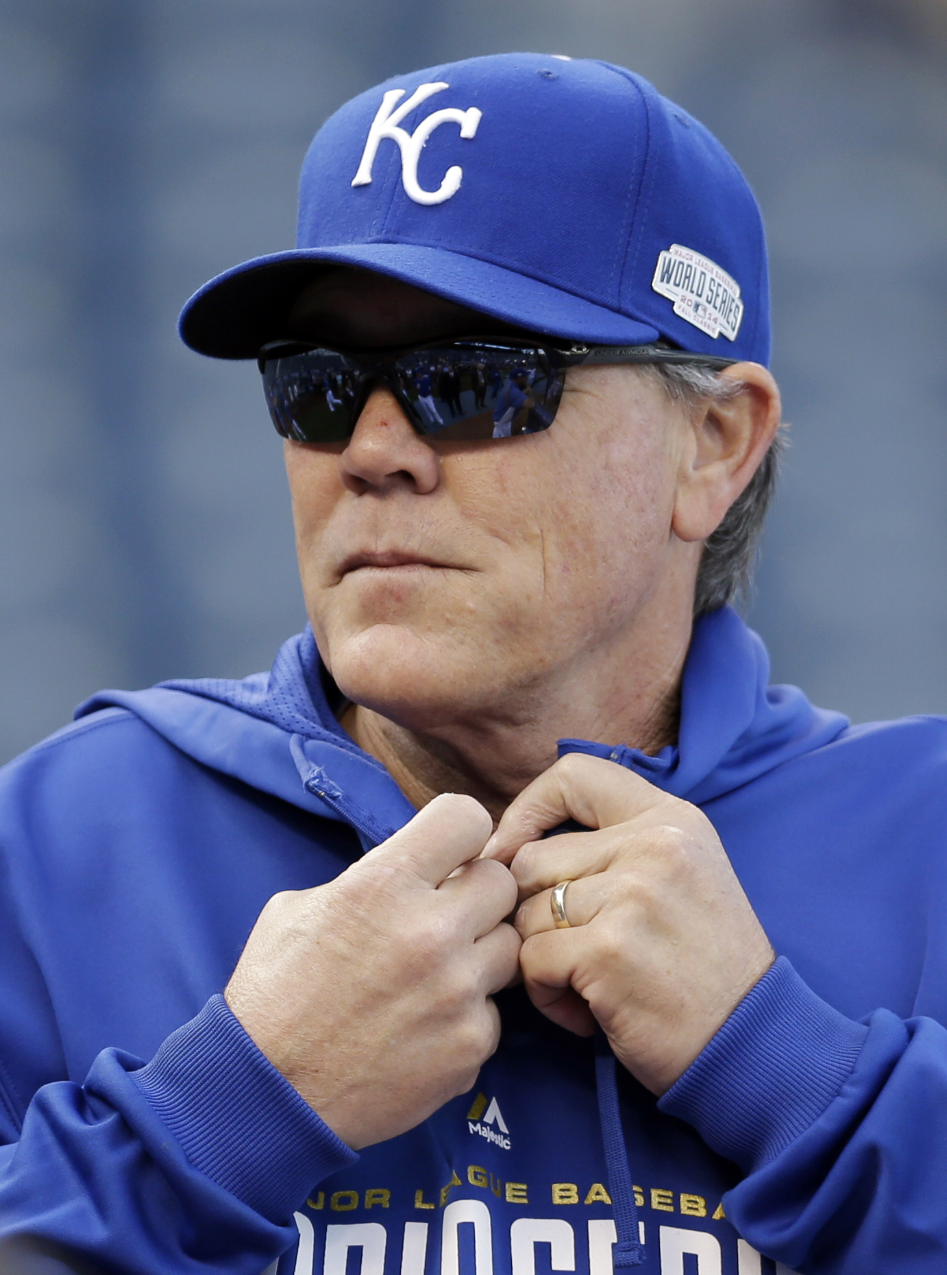 Kansas City Royals manager Ned Yost fixes his sweatshirt before Game 6 of baseball's World Series against the San Francisco Giants, Oct. 28, 2014, in Kansas City, Mo.