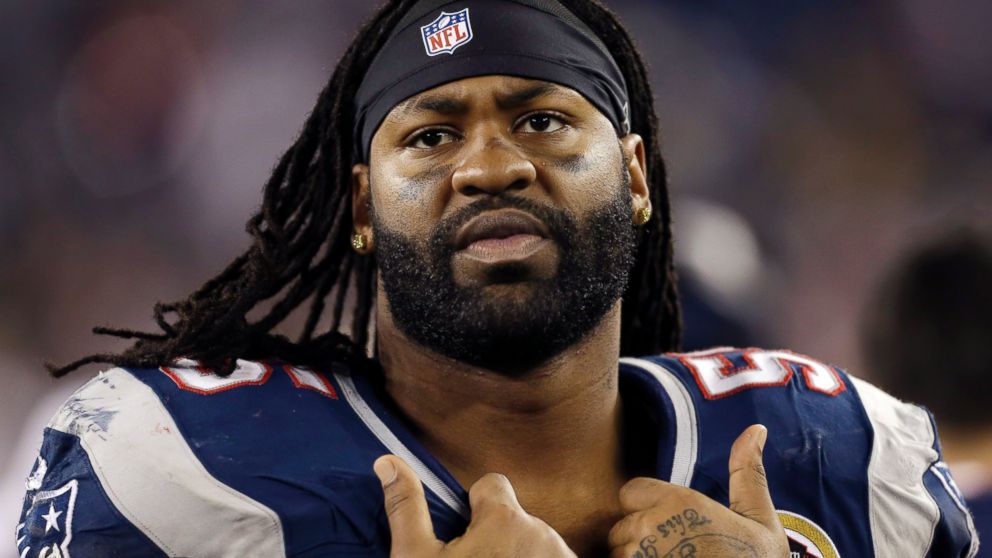 New England Patriots' Brandon Spikes watches from the bench in the fourth quarter of an NFL football game against the Houston Texans in Foxborough, Mass.,  Dec. 10, 2012