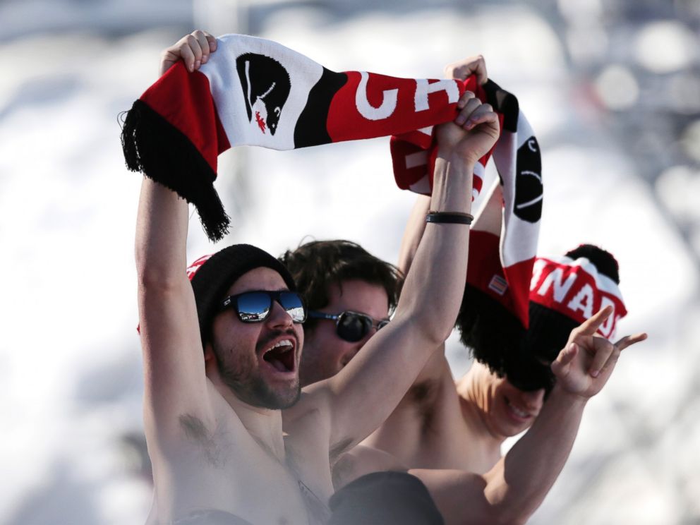 PHOTO: Canadian fans cheer during the men's ski slopestyle qualifying at the Rosa Khutor Extreme Park, at the 2014 Winter Olympics, Feb. 13, 2014, in Krasnaya Polyana, Russia.
