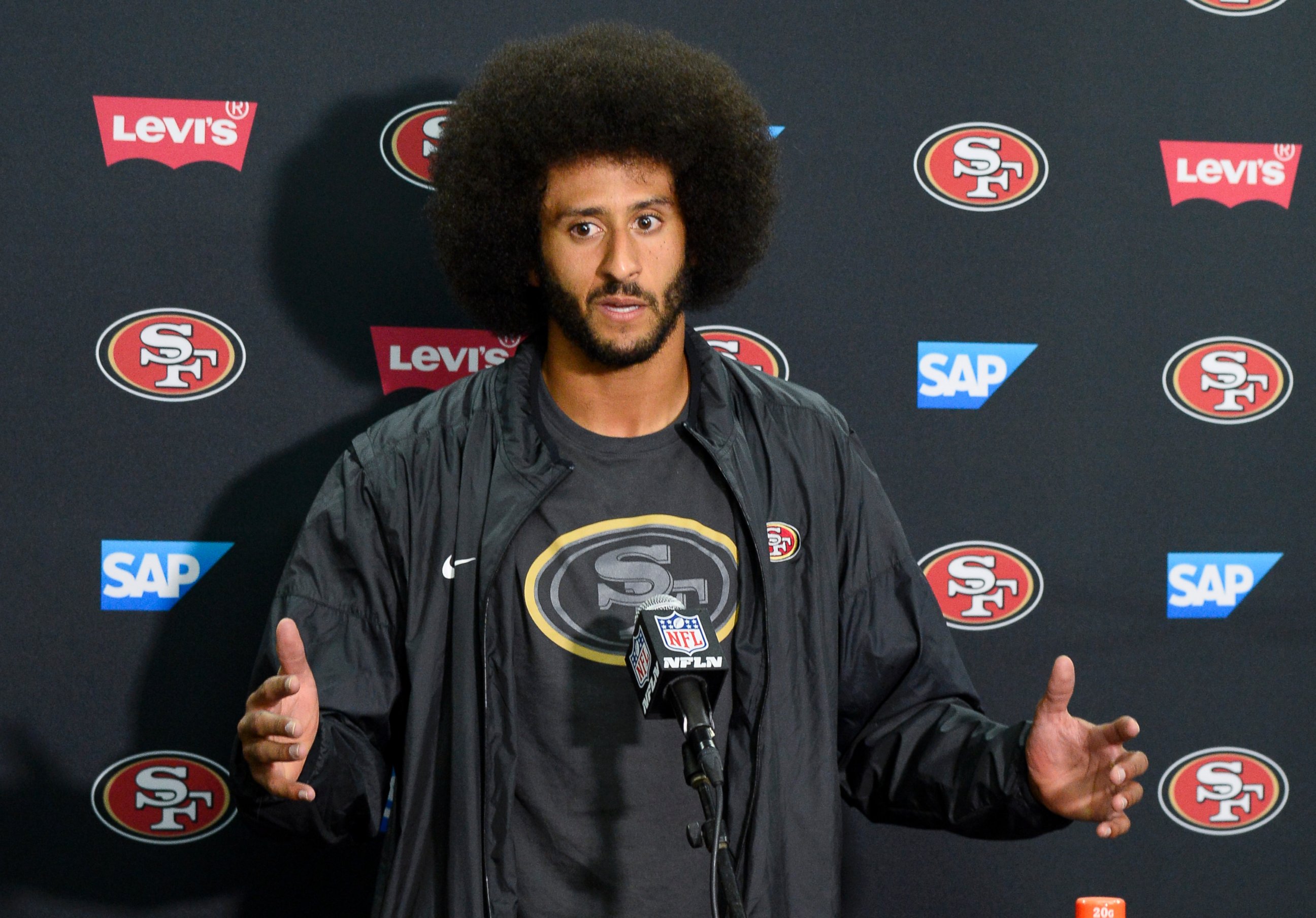 PHOTO: San Francisco 49ers quarterback Colin Kaepernick talks to the media at a news conference, Sept. 1, 2016, in San Diego. 