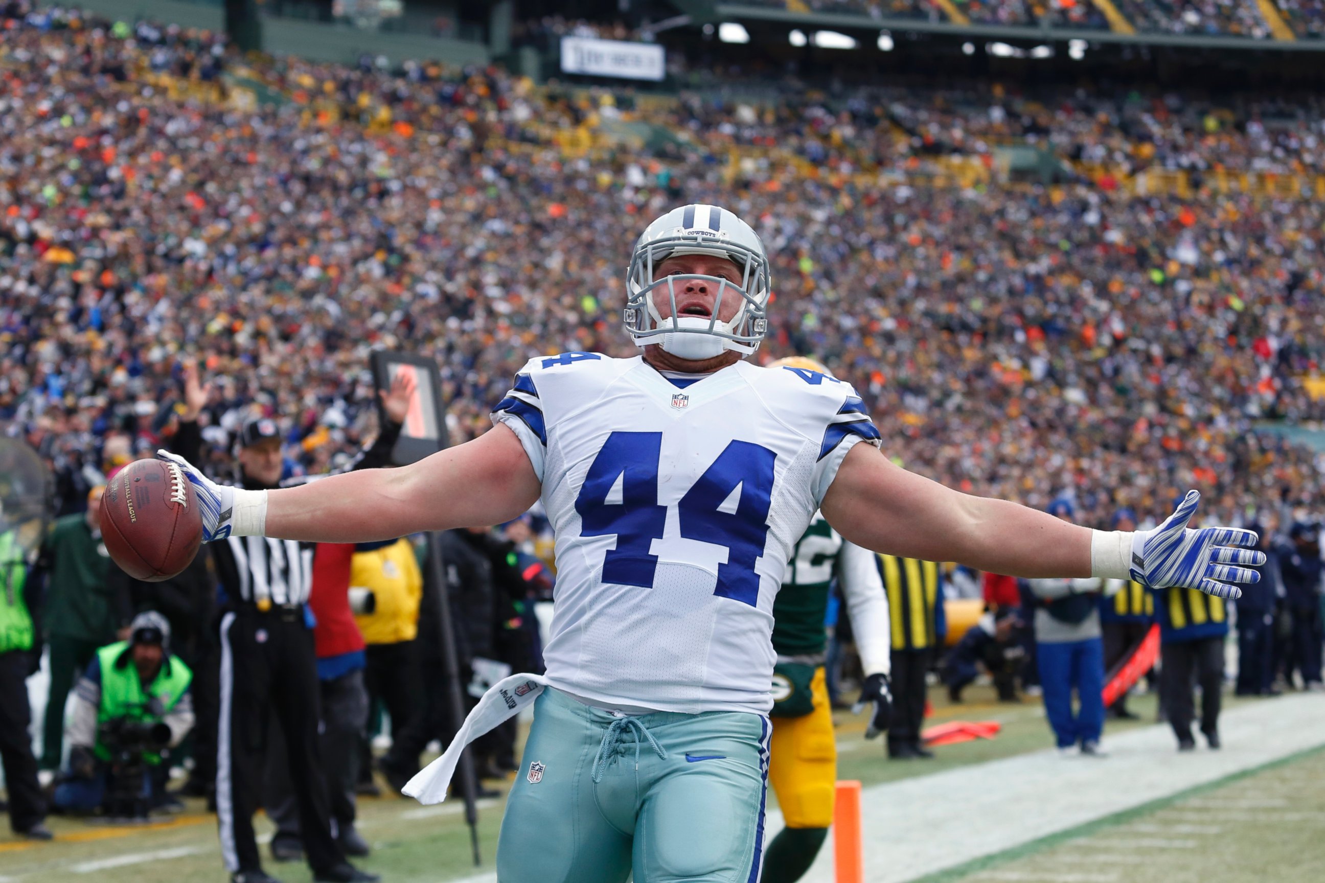 PHOTO: Dallas Cowboys fullback Tyler Clutts (44) celebrates a one-yard touchdown pass during the first half of an NFL divisional playoff football game against the Green Bay Packers Sunday, Jan. 11, 2015, in Green Bay, Wis. 