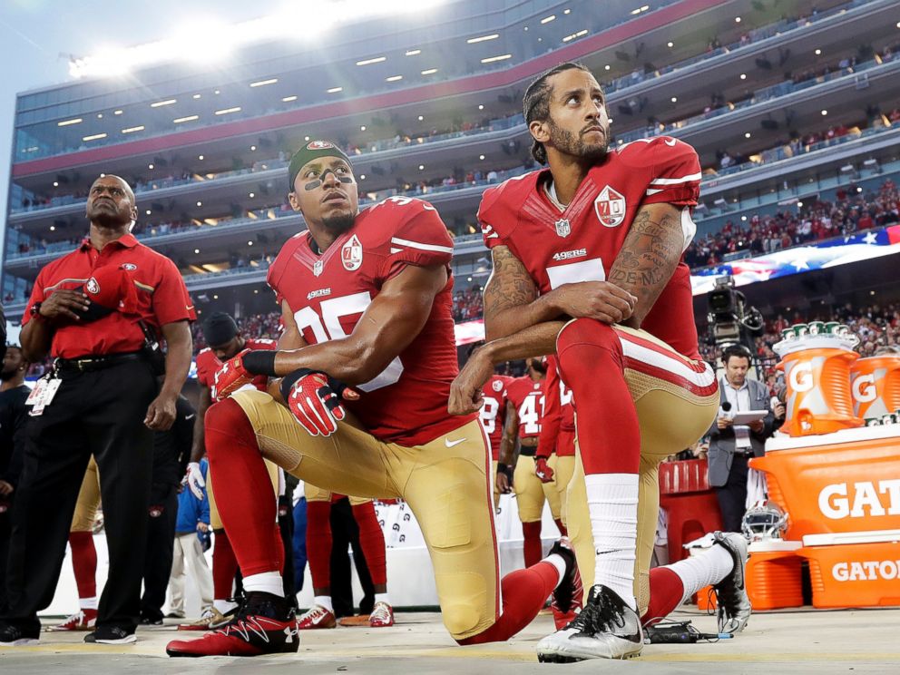In this Monday, Sept. 12, 2016, file photo, San Francisco 49ers safety Eric Reid (35) and quarterback Colin Kaepernick (7) kneel during the national anthem before an NFL football game against the Los Angeles Rams.