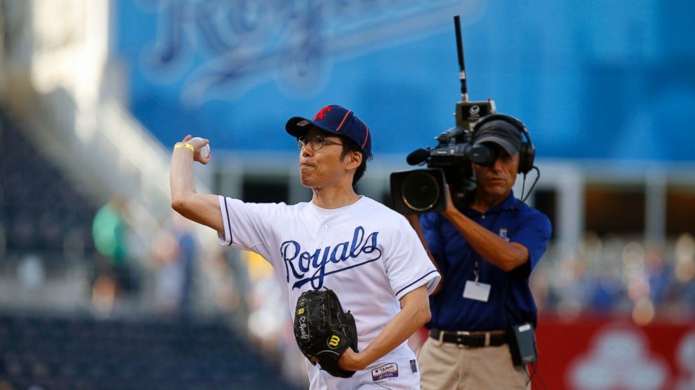 PHOTO: Sungwoo Lee, a South Korean Kansas City Royals fan gets the opportunity to throw out the first pitch before the MLB game between the Oakland Athletics and the Kansas City Royals at Kauffman Stadium in Kansas City, Mo., Aug. 11, 2014.