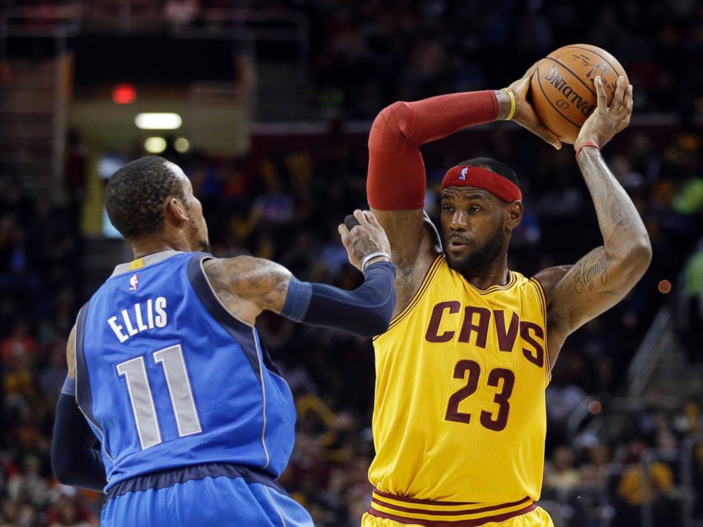 PHOTO: In this Oct. 17, 2014 file photo, Cleveland Cavaliers' LeBron James (23) goes against Dallas Mavericks' Monta Ellis (11) in a preseason NBA basketball game in Cleveland. 