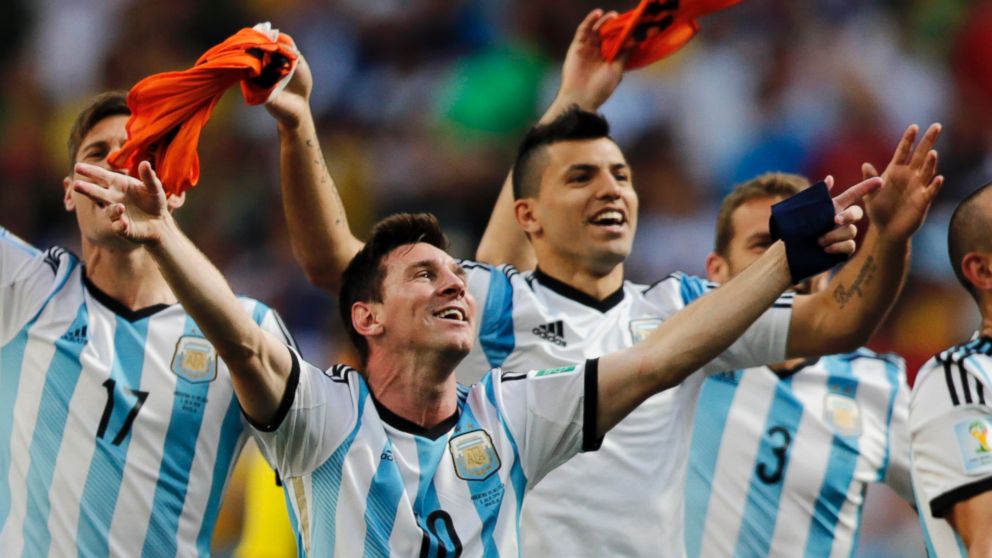 PHOTO: Argentina's Lionel Messi and teammates celebrate at the end of the World Cup quarterfinal soccer match between Argentina and Belgium at the Estadio Nacional in Brasilia, Brazil, July 5, 2014.