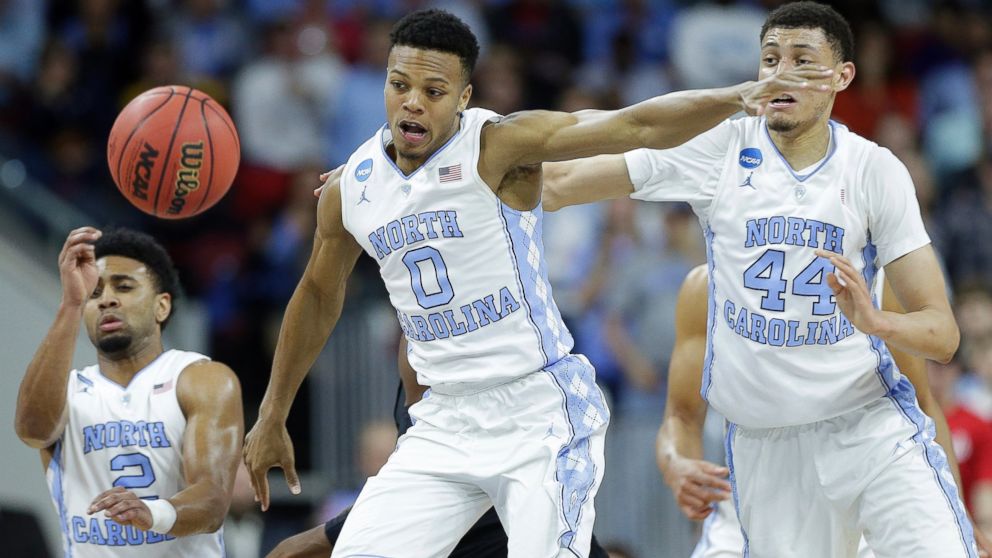PHOTO: North Carolina guard Nate Britt chases a loose ball against Providence during the second half of a second-round men's college basketball game in the NCAA Tournament, March 19, 2016, in Raleigh, N.C.
