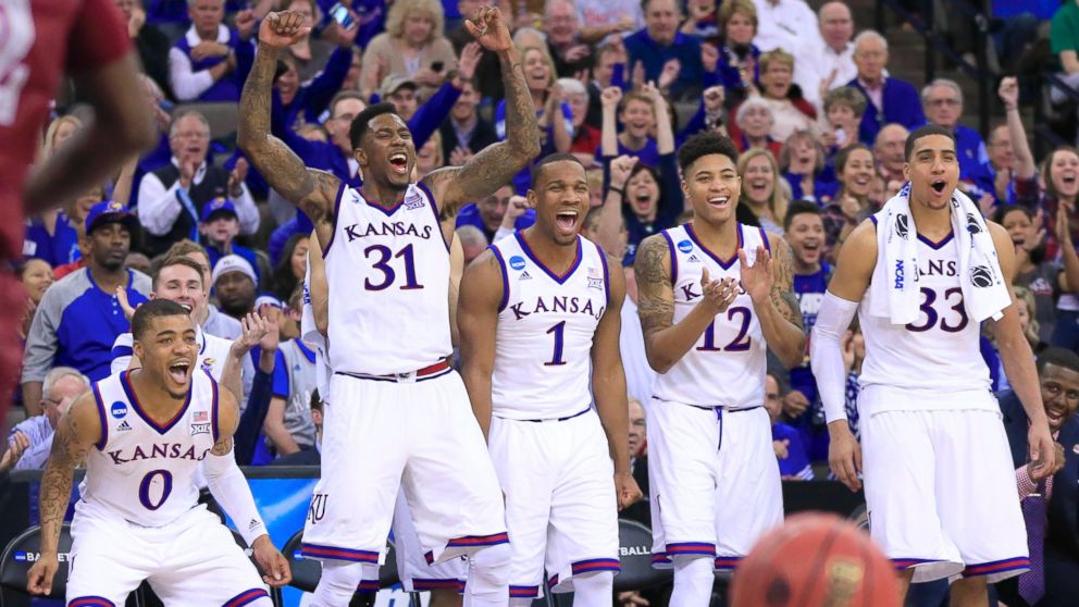 PHOTO: Kansas players cheer after a Kansas basket during the second half of an NCAA tournament college basketball game against New Mexico State in the Round of 64 in Omaha, March 20, 2015.