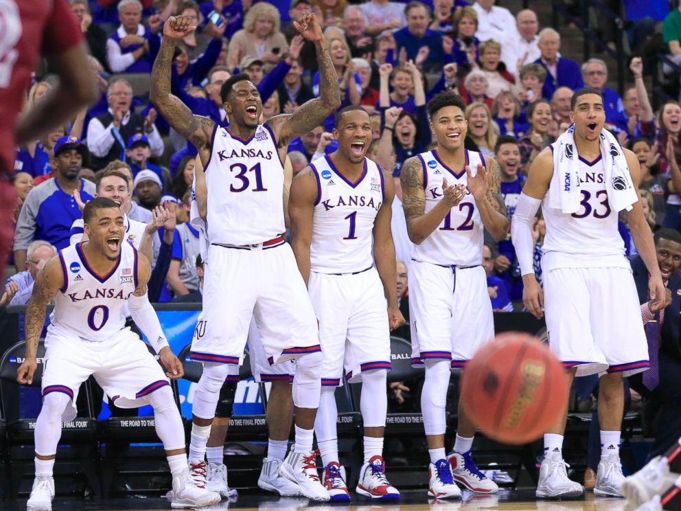 PHOTO: Kansas players cheer after a Kansas basket during the second half of an NCAA tournament college basketball game against New Mexico State in the Round of 64 in Omaha, March 20, 2015.