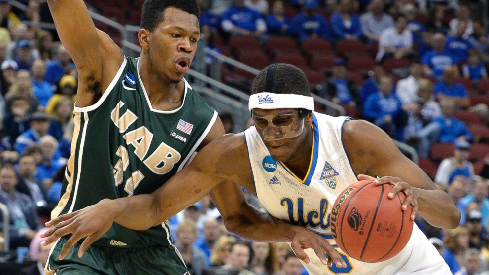 PHOTO: UCLA's Kevon Looney, right, attempts to drive around the defense of UAB's William Lee during the first half of an NCAA tournament college basketball game in Louisville, Ky., March 21, 2015.  