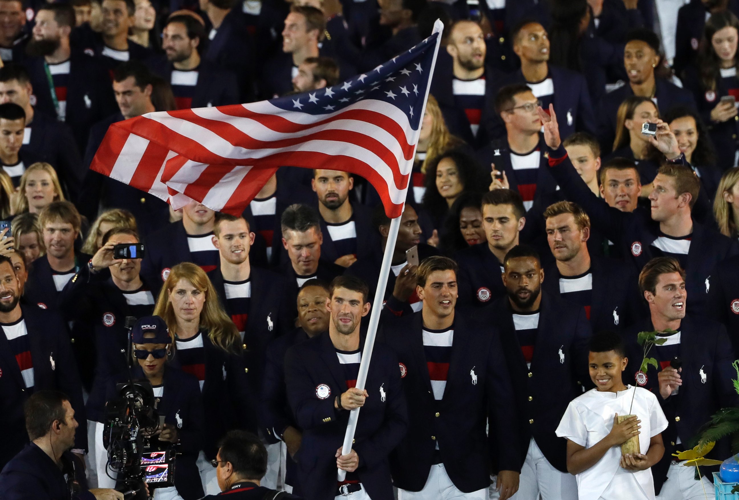 PHOTO: Michael Phelps carries the flag of the United States during the opening ceremony for the 2016 Summer Olympics in Rio de Janeiro, Brazil, Aug. 5, 