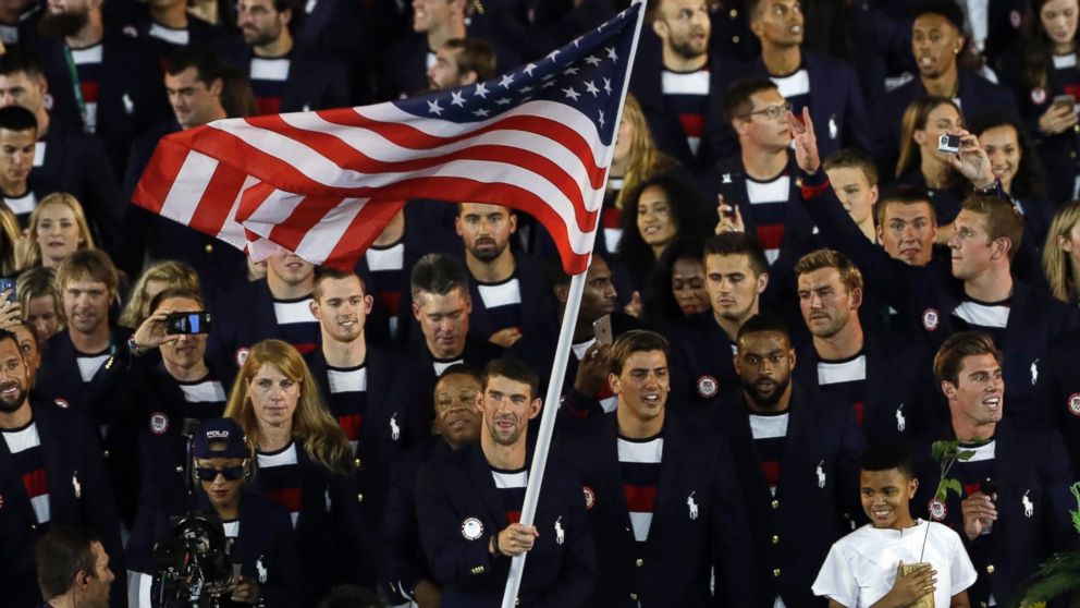 PHOTO: Michael Phelps carries the flag of the United States during the opening ceremony for the 2016 Summer Olympics in Rio de Janeiro, Brazil, Aug. 5,