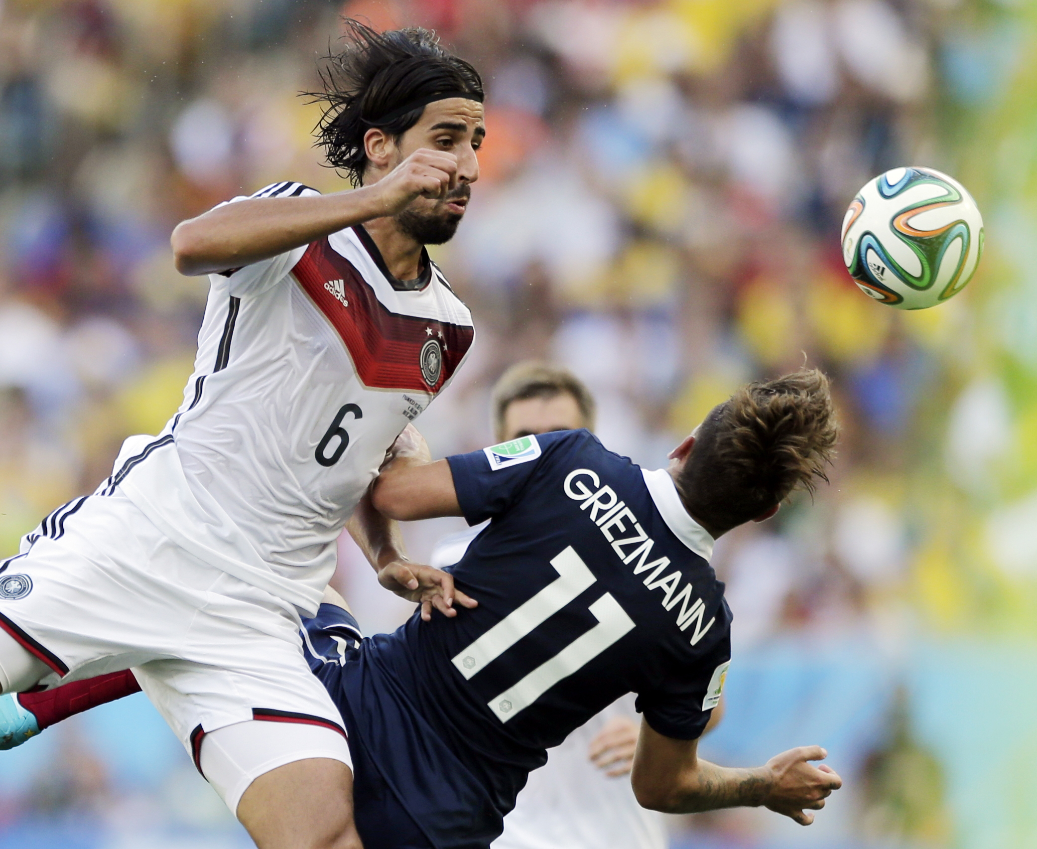 PHOTO: Germany's Sami Khedira heads the ball against France's Antoine Griezmann during the World Cup quarterfinal soccer match at the Maracana Stadium in Rio de Janeiro, Brazil, July 4, 2014.