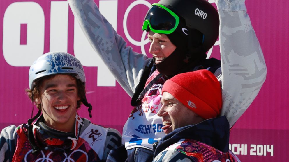 Gold medal winner Joss Christensen of the United States, top, is carried by compatriots Nicholas Goepper, left, who won bronze, and Gus Kenworthy, who won silver,  after the men's ski slopestyle final at the 2014 Winter Olympics, Feb. 13, 2014.