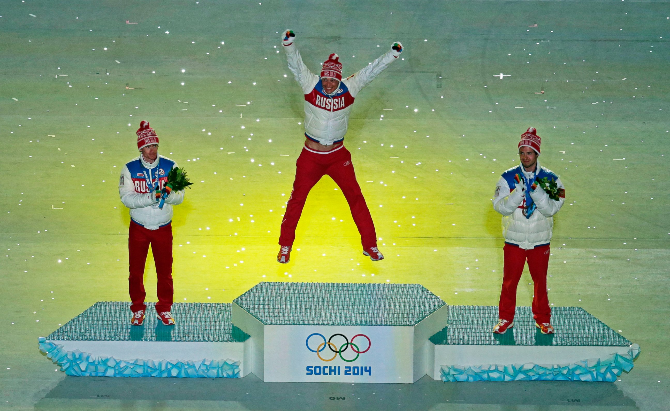 PHOTO: Russia's medal winners pose during the medal ceremony for the men's 50-kilometer cross-country race during the closing ceremony of the 2014 Winter Olympics, Sunday, Feb. 23, 2014, in Sochi, Russia.