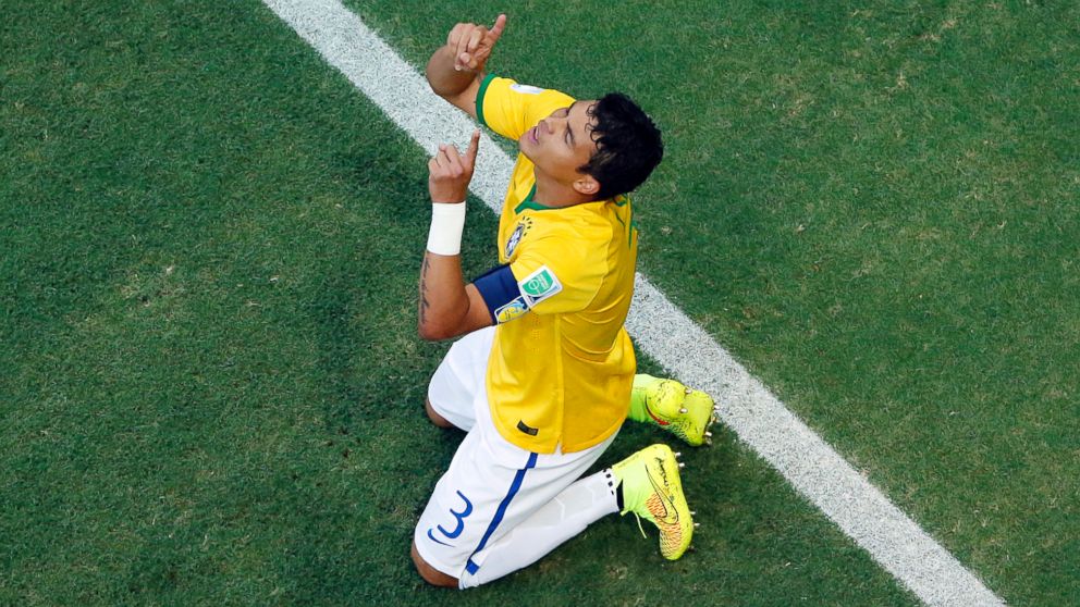 Brazil's Thiago Silva celebrates after scoring his side's first goal during the World Cup quarterfinal soccer match between Brazil and Colombia at the Arena Castelao in Fortaleza, Brazil, July 4, 2014.