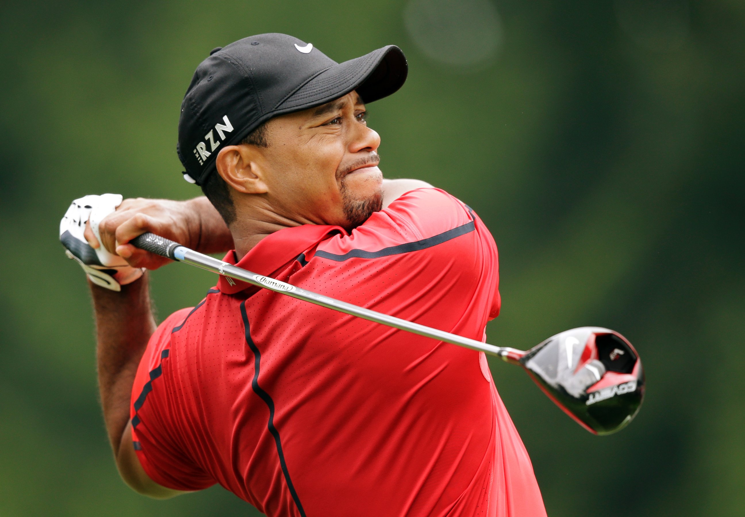 PHOTO: Tiger Woods watches his tee shot on the fourth hole during the final round of the Bridgestone Invitational golf tournament on Aug. 3, 2014, at Firestone Country Club in Akron, Ohio.