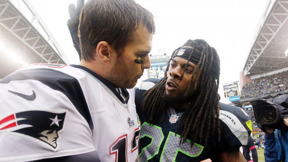 New England Patriots quarterback Tom Brady and Seattle Seahawks' Richard Sherman speak after an NFL football game, Oct. 14, 2012, in Seattle. 