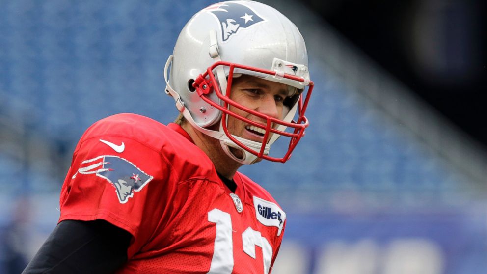 PHOTO: New England Patriots quarterback Tom Brady (12) smiles as he runs through a drill during NFL football practice at Gillette Stadium in Foxborough, Mass., Jan. 14, 2015.