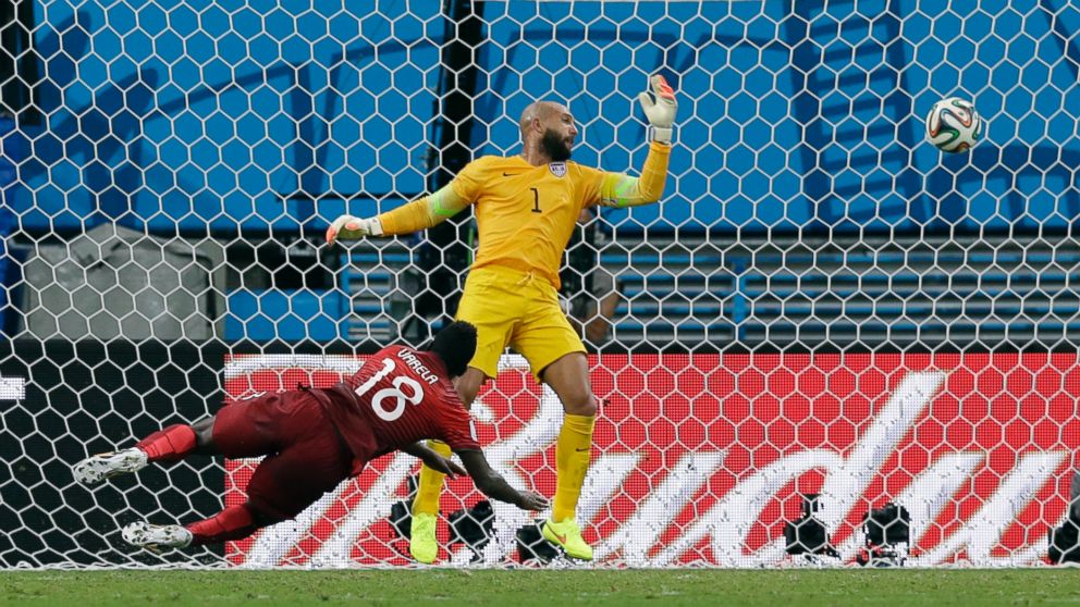 Portugal's Silvestre Varela heads the ball past United States' goalkeeper Tim Howard to tie the game 2-2 during the group G World Cup soccer match between the USA and Portugal at the Arena da Amazonia in Manaus, Brazil, June 22, 2014.