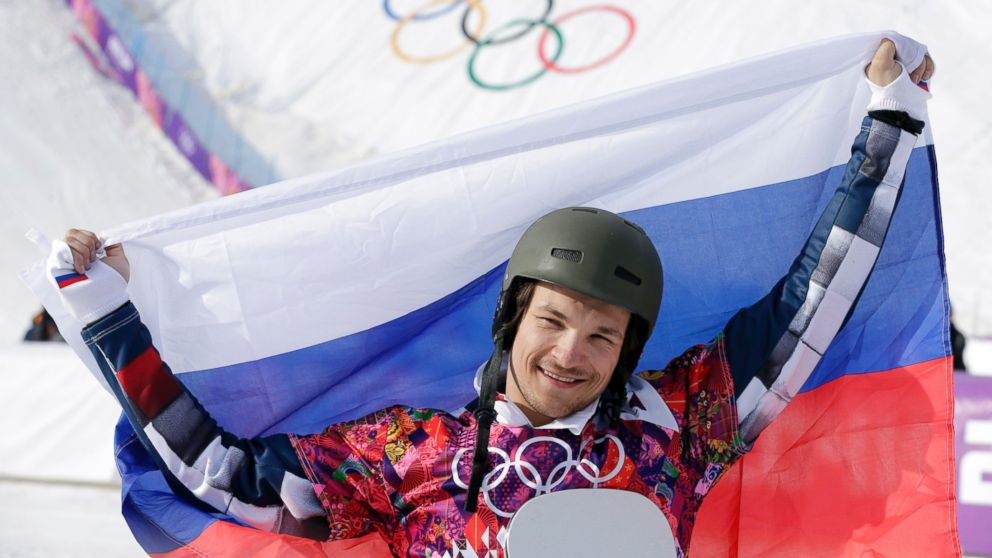 Russia's Vic Wild celebrates his gold medal in the men's snowboard parallel slalom final at the Rosa Khutor Extreme Park, at the 2014 Winter Olympics, Saturday, Feb. 22, 2014, in Krasnaya Polyana, Russia. 