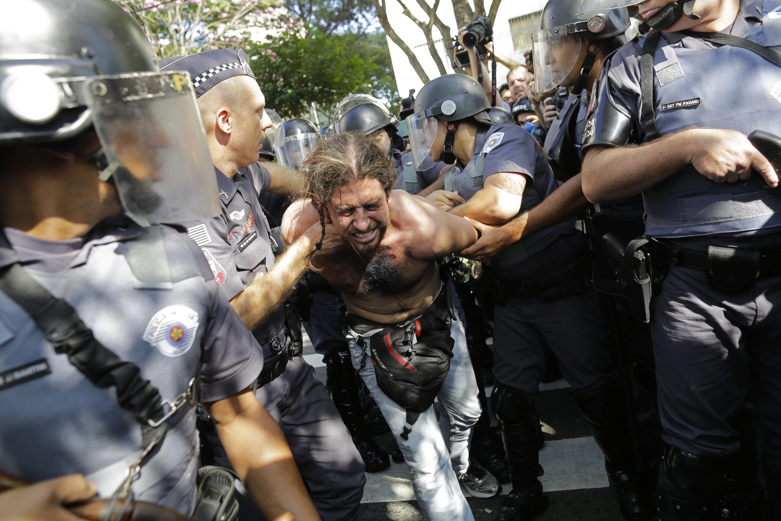 PHOTO: A protester is detained by police during a demonstration by people demanding better public services and against the money spent on the World Cup soccer tournament in Sao Paulo, Brazil, June 12, 2014. 