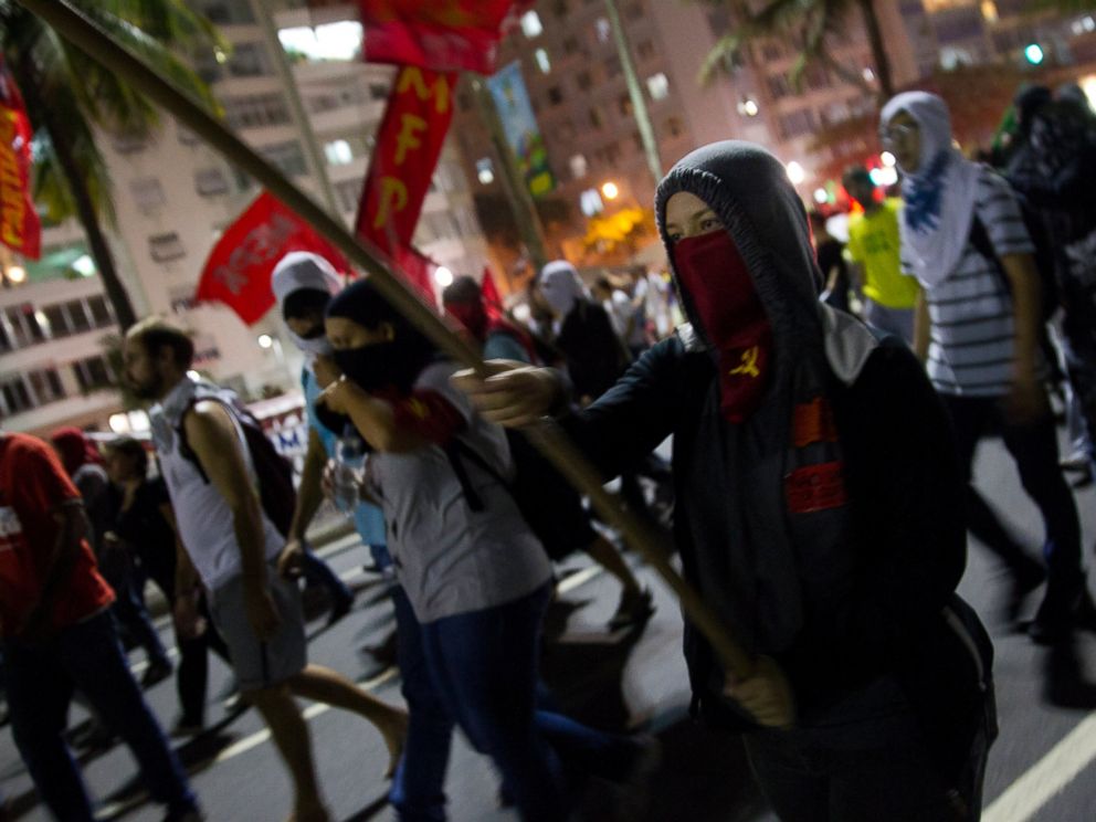 PHOTO: Demonstrators protest during a march against the FIFA 2014 soccer World Cup at Copacabana beach, Rio de Janeiro, Brazil, June 12, 2014. The demonstrators are demanding better public services and protesting the money spent on the soccer tournament.