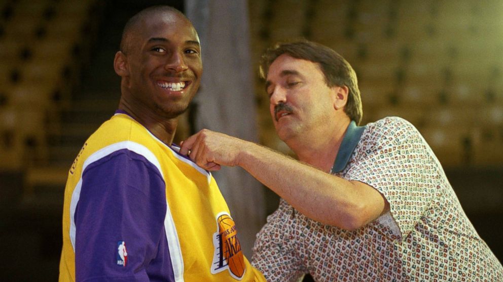 PHOTO: Los Angeles Lakers rookie Kobe Bryant is heckled by teammates as a television cameraman adjusts a microphone on his jersey for an interviewed during the Lakers Media Day at the Forum in Inglewood, California, Oct. 14, 1996.