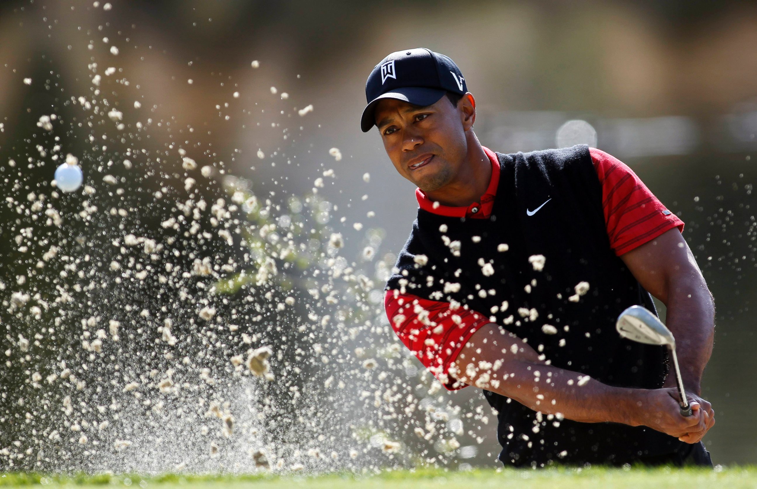 PHOTO: Tiger Woods hits out of a sand trap on the third hole during the final round of the Chevron World Challenge golf tournament at Sherwood Country Club, Dec. 4, 2011, in Thousand Oaks, Calif.