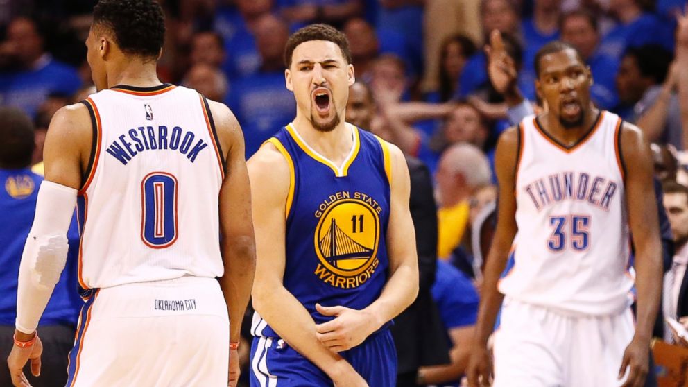 Golden State Warriors player Klay Thompson (C) reacts after shooting a three point basket against the Oklahoma City Thunder in the second half of the NBA Western Conference Finals basketball game six, May 28, 2016.