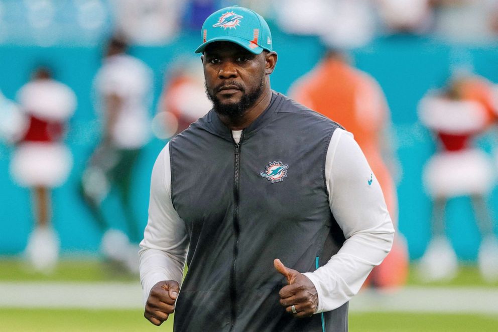 PHOTO: Miami Dolphins head coach Brian Flores runs off the field after winning the game against the New York Jets, Dec 19, 2021, Miami Gardens, Fla.