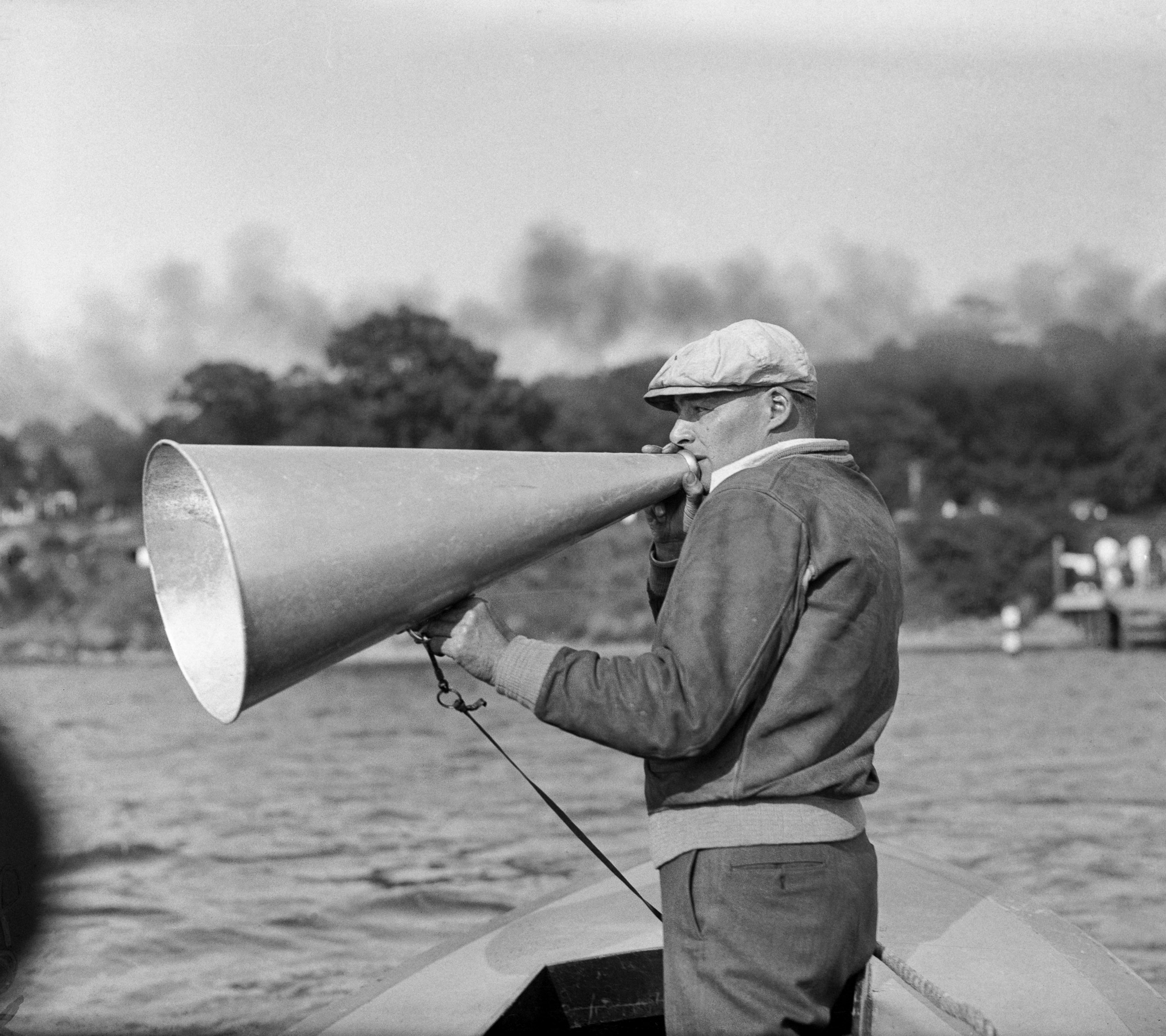 PHOTO: Charles Whiteside, coach of the Harvard University Crews, is seen here as he sent his men through their paces during a workout on the Thames River, Red Top, Connecticut, in preparation for the coming regatta against Yale University.