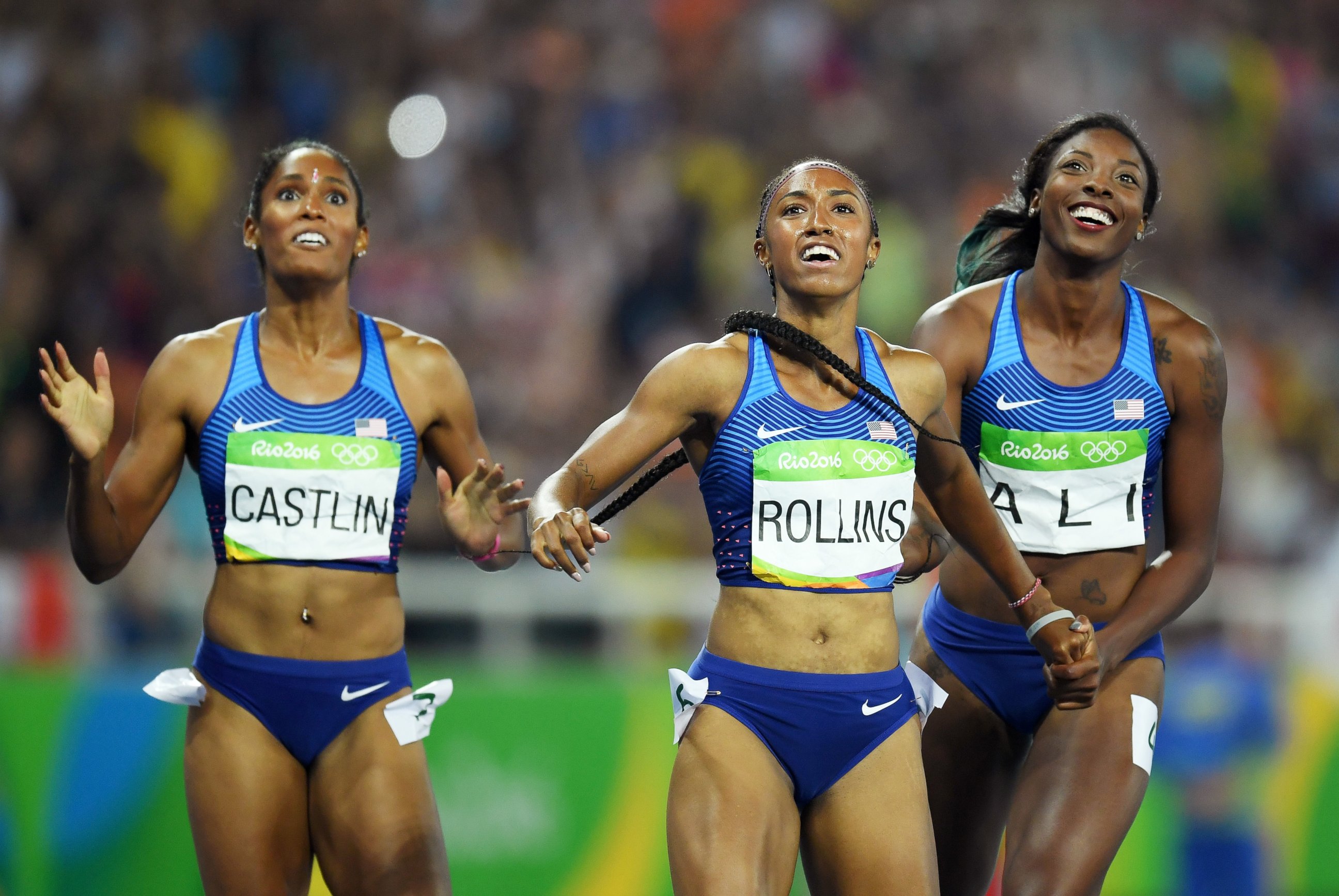 PHOTO: Bronze medalist Kristi Castlin, gold medalist Brianna Rollins and silver medalist Nia Ali of the United States react after the Women's 100m Hurdles Final